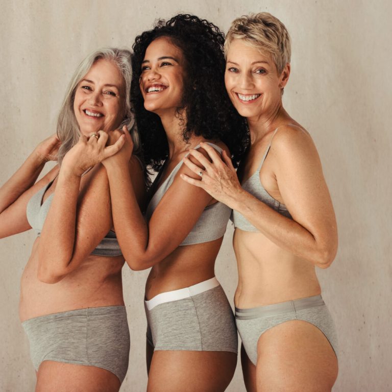 Natural,Women,Of,Different,Ages,Embracing,Each,Other,In,A